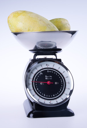 scales for kitchen or kitchen scales with mangoの写真素材