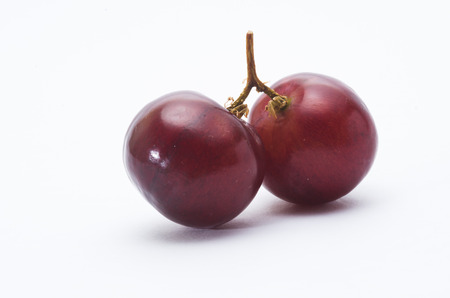 red grape isolated on whiteの写真素材