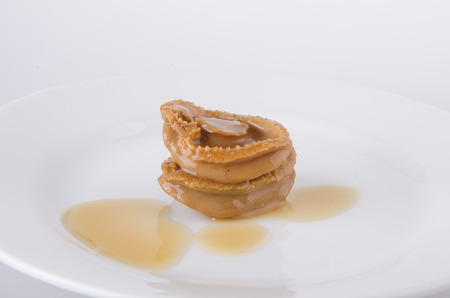 Chinese cuisine abalone on the white background.の写真素材