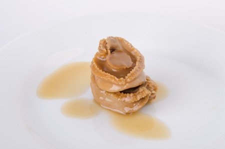 Chinese cuisine abalone on the white background.の写真素材