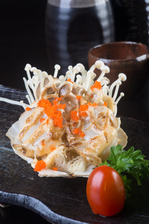 japanese cuisine. grilled shell fish on backgroundの写真素材