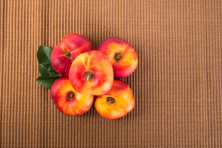 donut peaches. flat peaches on the backgroundの写真素材