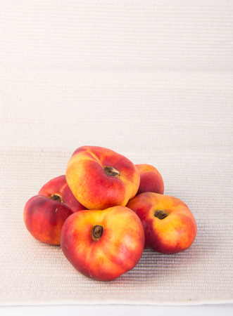 donut peaches. flat peaches on the backgroundの写真素材