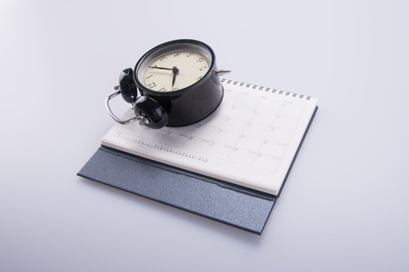 alarm clock with calendar. alarm clock with calendar on backgroundの写真素材