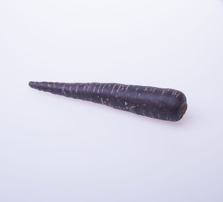 carrot or black carrot on a backgroundの写真素材