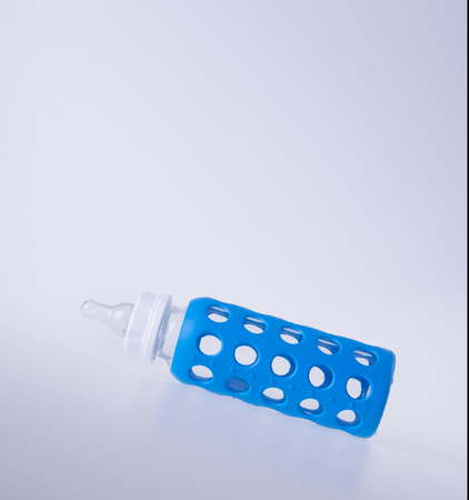 baby glass bottle. baby glass bottle on a backgroundの写真素材