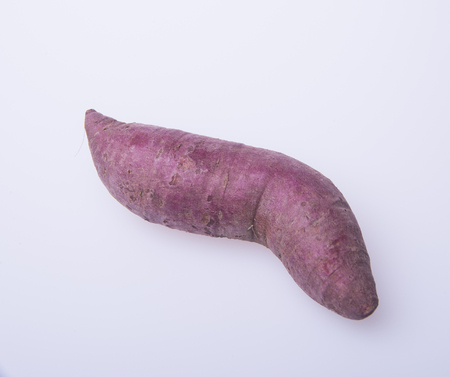 sweet potato or red sweet potato on a backgroundの写真素材