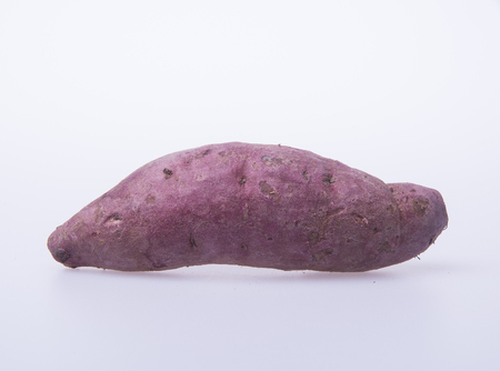 sweet potato or red sweet potato on a backgroundの写真素材