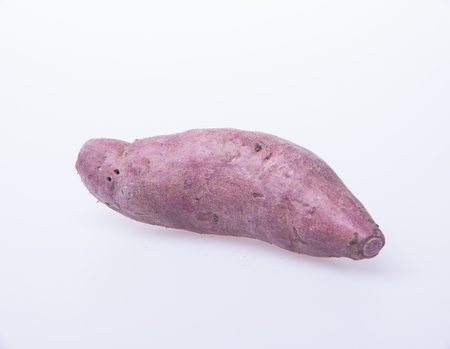 sweet potato or red sweet potato on a backgroundの写真素材