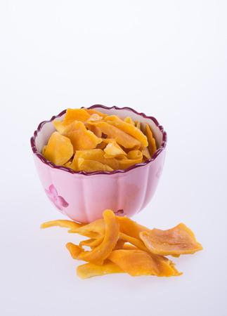 mango dry in bowl or dried mango slicesの写真素材