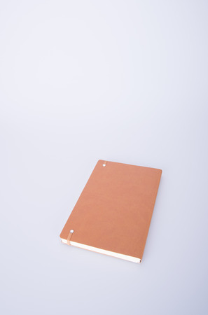notebook or brown cover notebooks on the blackgroundの写真素材