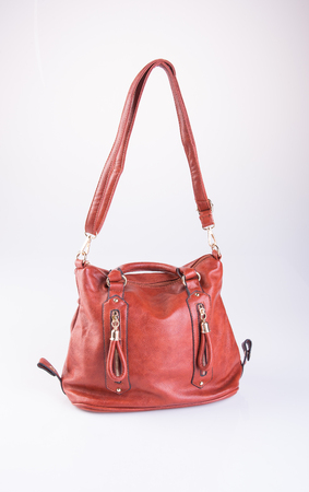 bag or brown leather woman handbag on backgroundの写真素材