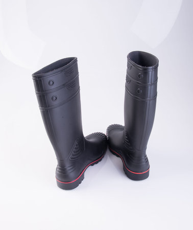 shoe or black color rubber boots on a backgroundの写真素材