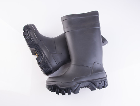 shoe or black color rubber boots on a backgroundの写真素材