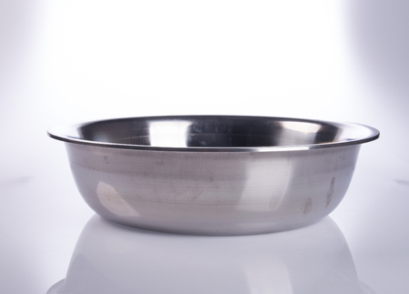 pot or stainless steel pot on a backgroundの写真素材
