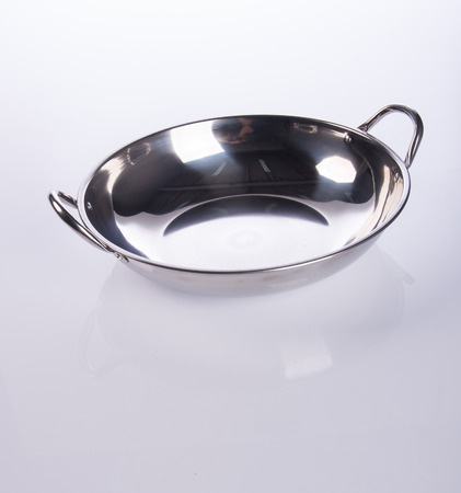 pan or stainless steel pan on backgroundの写真素材