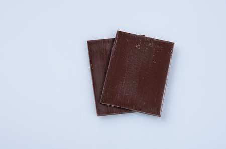 Chocolate bar or pieces on a backgroundの写真素材