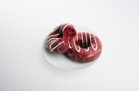 donut or donut with missing bite on a backgroundの写真素材