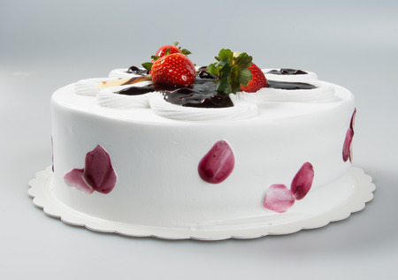 cake or cake with strawberries and chocolate on a backgroundの写真素材