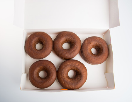 A box of doughnuts on a backgroundの写真素材