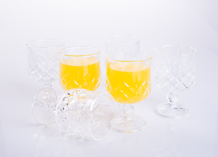 Orange juice in glasses on the backgroundの写真素材