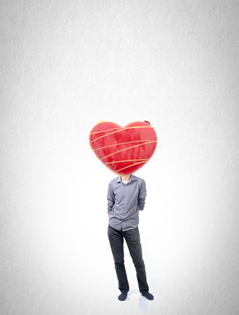 Man and donut with concept on a backgroundの写真素材