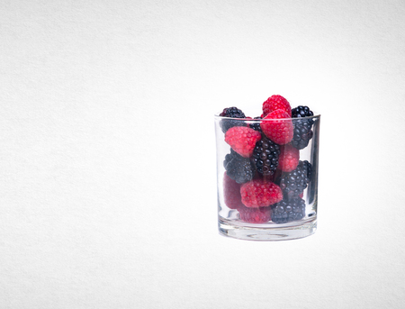 raspberry and blackberries on white isolated backgroundの写真素材