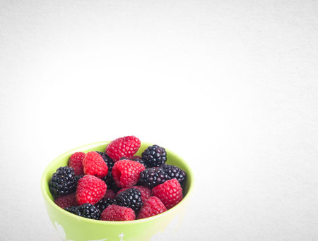 raspberry and blackberries on white isolated background
