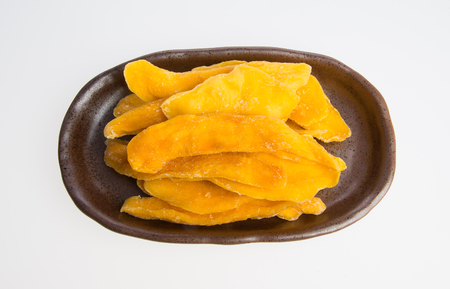 Dried Mango or Dried Mango slices on a backgroundの写真素材