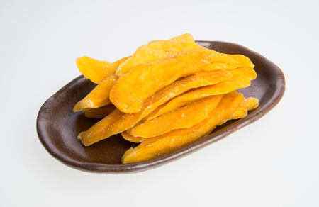 Dried Mango or Dried Mango slices on a backgroundの写真素材