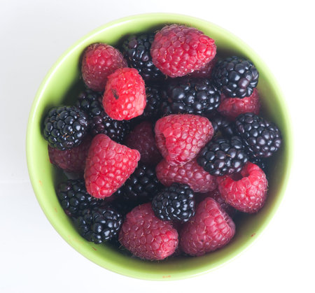 raspberry and blackberry on white isolated background