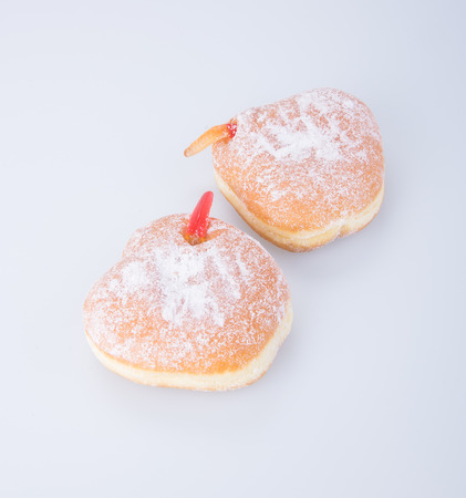 Two sugar coated Halloween donuts on white backgroundの写真素材