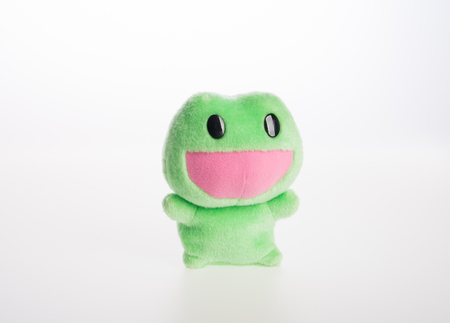 toy or frog soft toy on the backgroundの写真素材