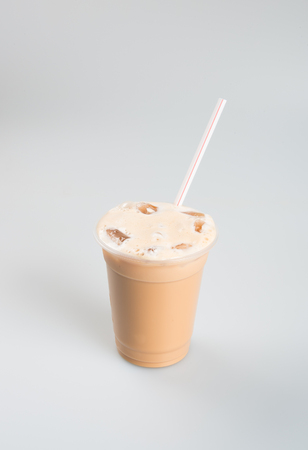 Iced tea or coffee with milk on a backgroundの写真素材