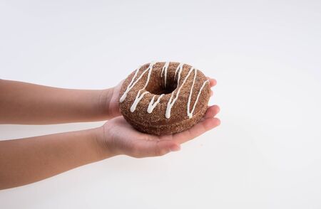 Donut or Donuts with hand on a background newの写真素材