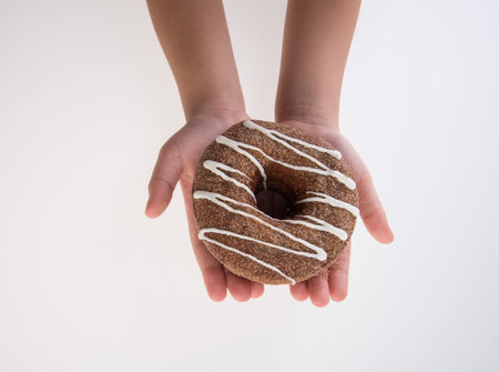 Donut or Donuts with hand on a background newの写真素材