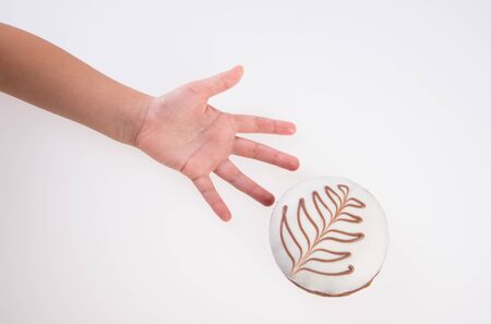 Donut or Donuts with hand on a background newの写真素材