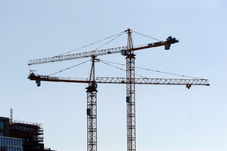 Two cranes constructing a new buildingの写真素材
