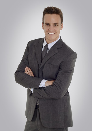 Man wearing suit smiling on studio shotの写真素材