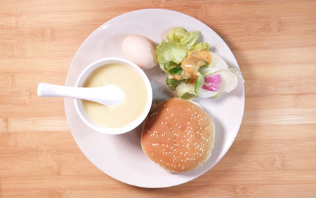 Healthy nutrition burger with salad, egg, onion and  rice porridge cerealの写真素材