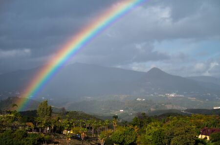 A rainbow is a meteorological phenomenon that is caused by reflection, refraction and dispersion of light in water droplets resulting in a spectrum of light appearing in the sky.の写真素材