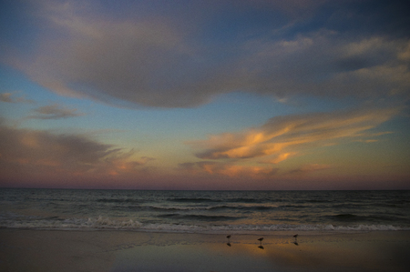 Colorful Sunset Clouds over Ocean Along Seasideの写真素材