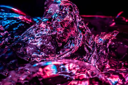 Boiling water macro in neon blue pink colorsの写真素材