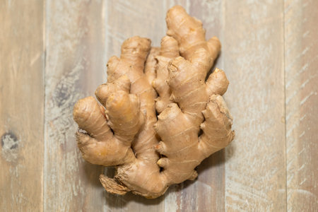 Fresh ginger root on the wooden table