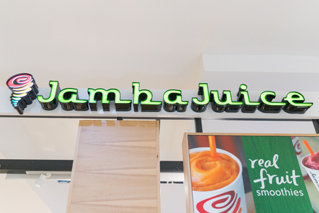 Philadelphia, Pennsylvania, May 21 2018: Jamba Juice Business Sign Company icon on the storefront wall.のeditorial素材