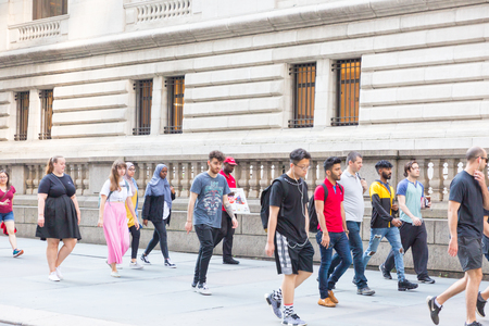 New York - June 2, 2018: A view down a busy avenue street, People walk on busy streetsのeditorial素材
