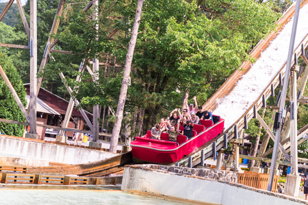 Elysburg, PA June 24 2018: people enjoying a water slide in a theme park in the Elysburgのeditorial素材