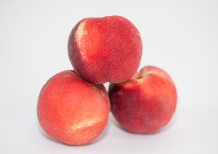 Peach isolated on table. Full depth of field.の写真素材