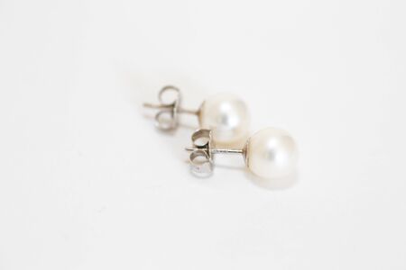 White pearl pieced earrings pair fine jewelry isolated on white - Imageの写真素材