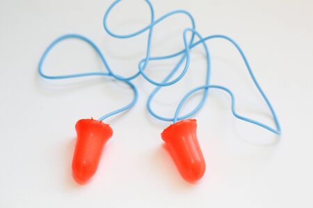 Two orang earplugs on white - Imageの写真素材